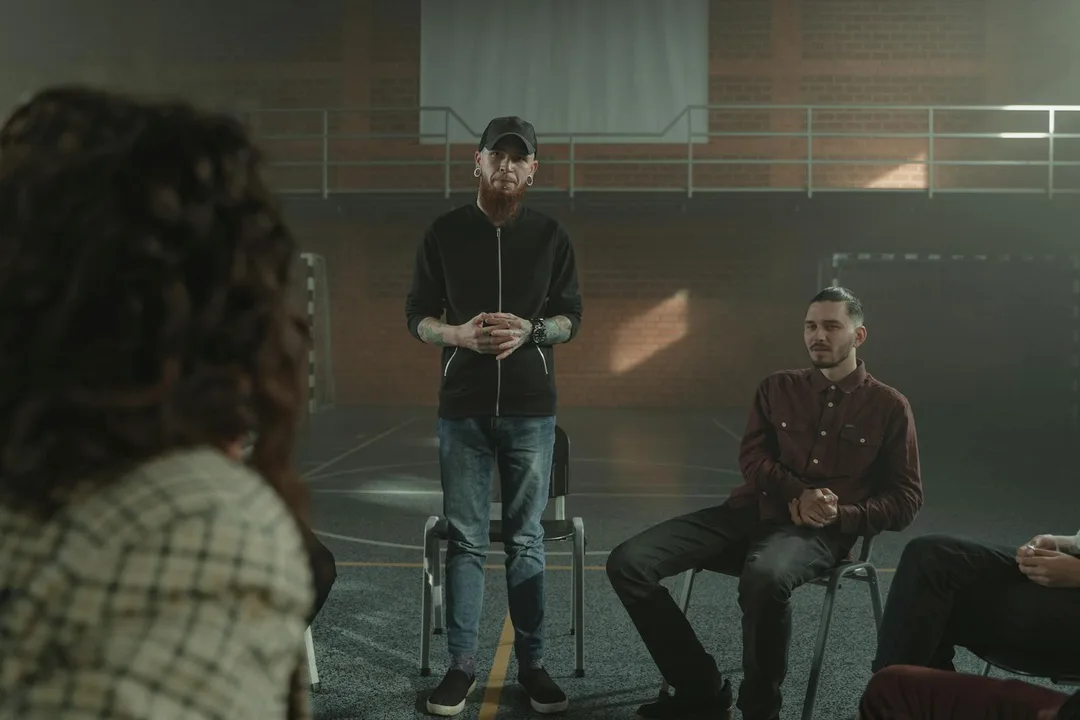 Carers sharing experiences together in a group support session